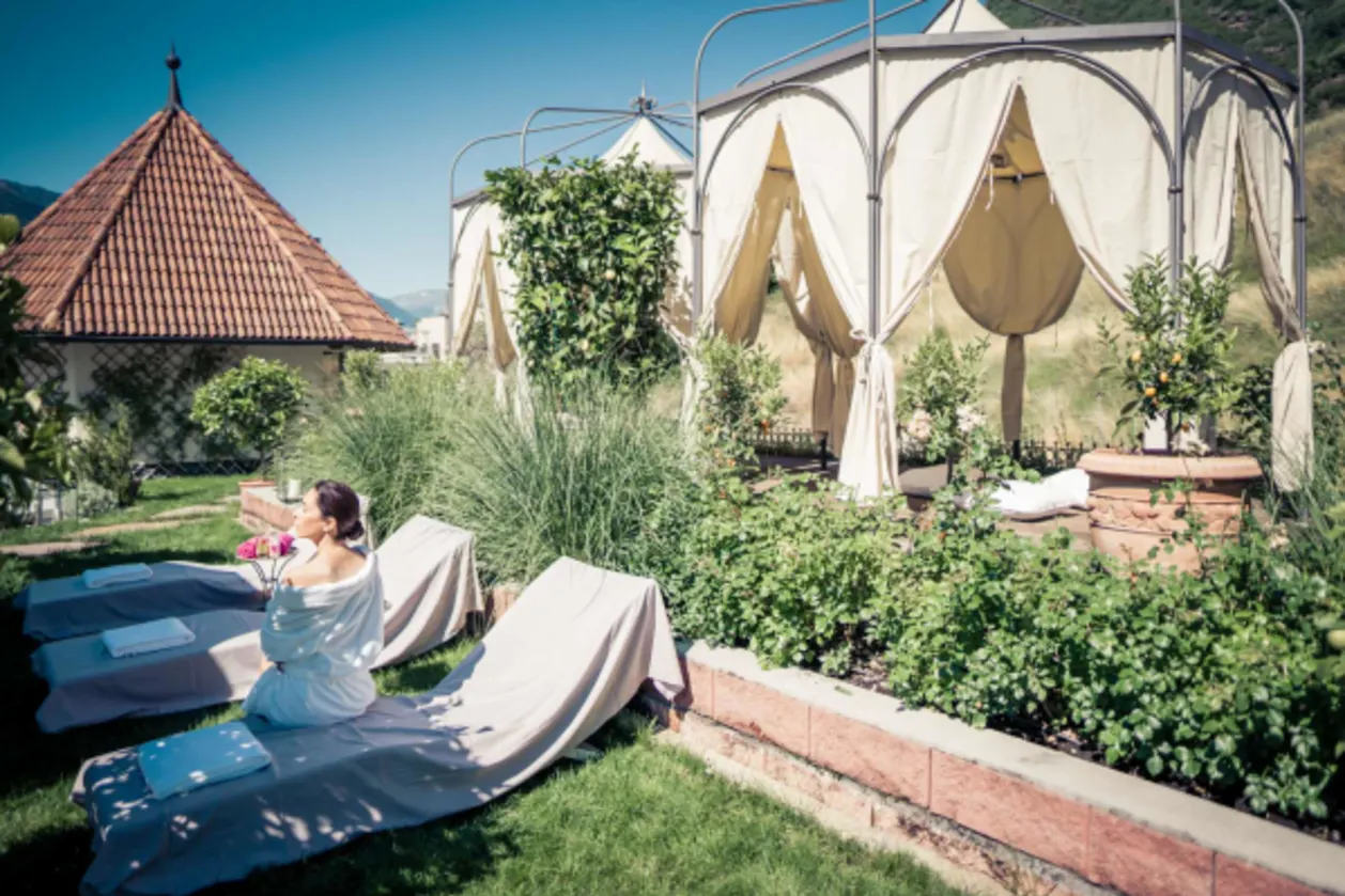 Relaxation in the gardens at Preidlhof wellness hotel in the Dolomites